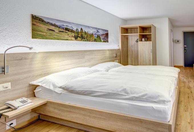 Exemple d'une chambre de 3 lits balcon côté sud Exemple d'une chambre de 3 lits balcon côté sud
