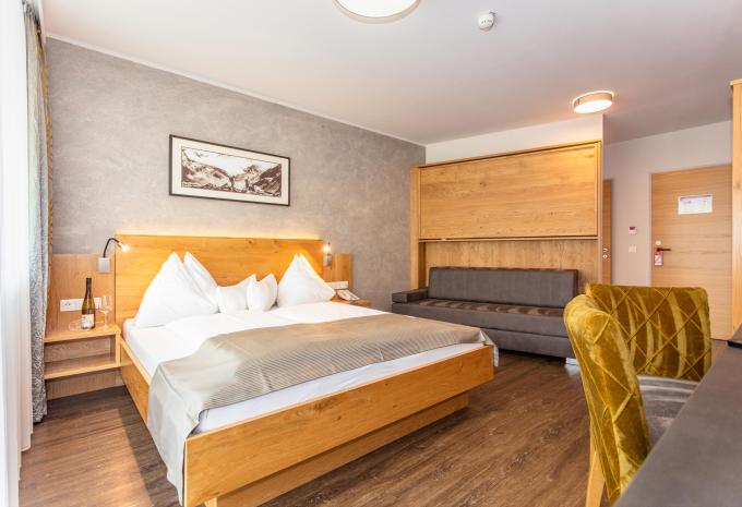 Esempio di camera: camera a più letti Deluxe balcone